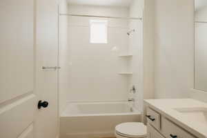 Full bathroom featuring shower / washtub combination and vanity
