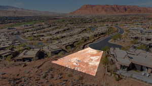 Aerial overview of property's location featuring nearby suburban area and mountains