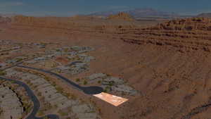 Aerial overview of property's location with a desert landscape and a mountain backdrop