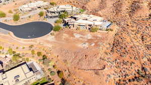 View of property location featuring a desert landscape and nearby suburban area
