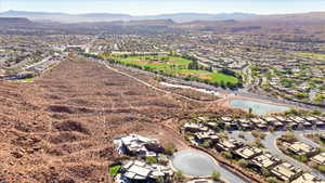 View of property location featuring nearby suburban area and a water and mountain view