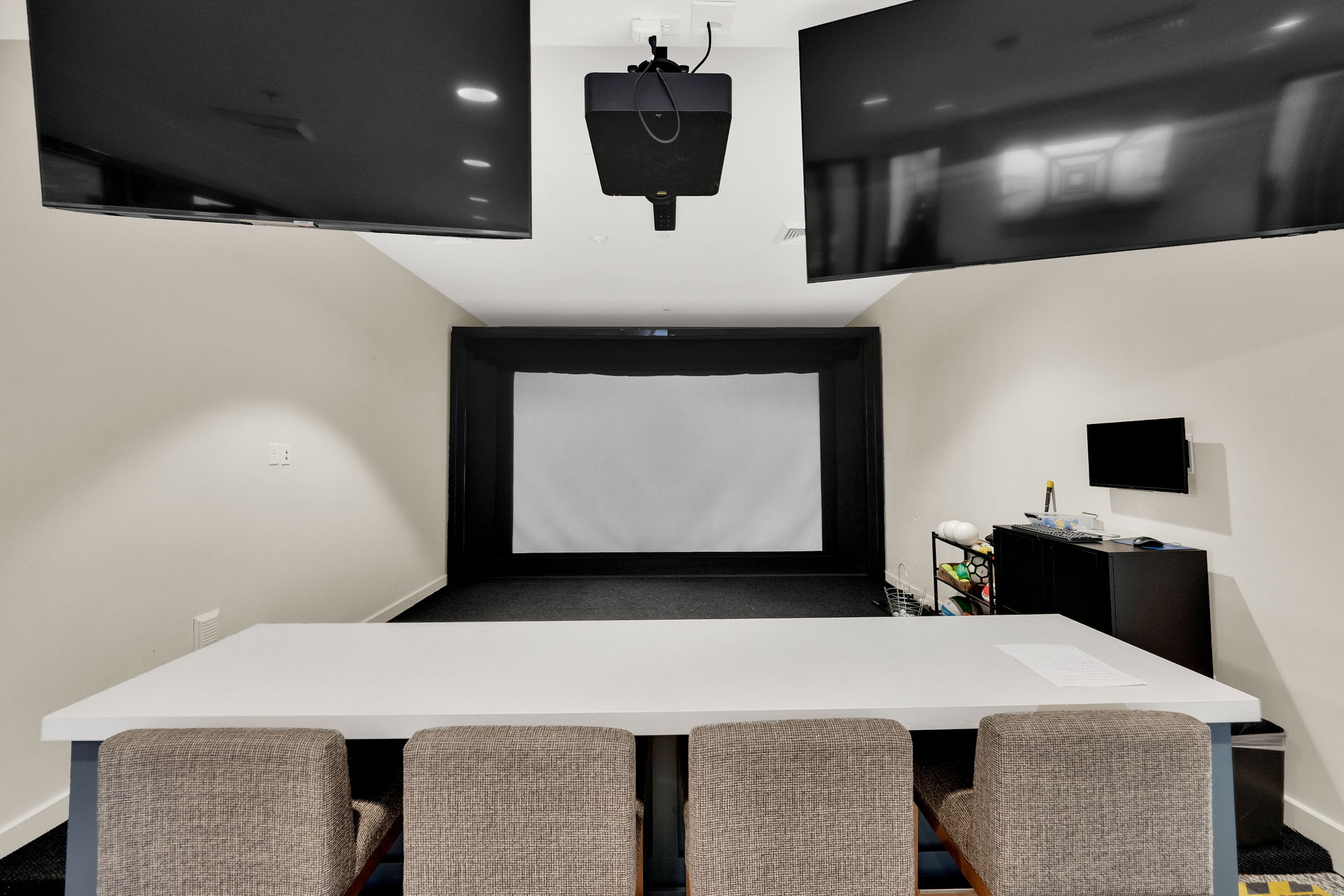 Office featuring baseboards and golf simulator