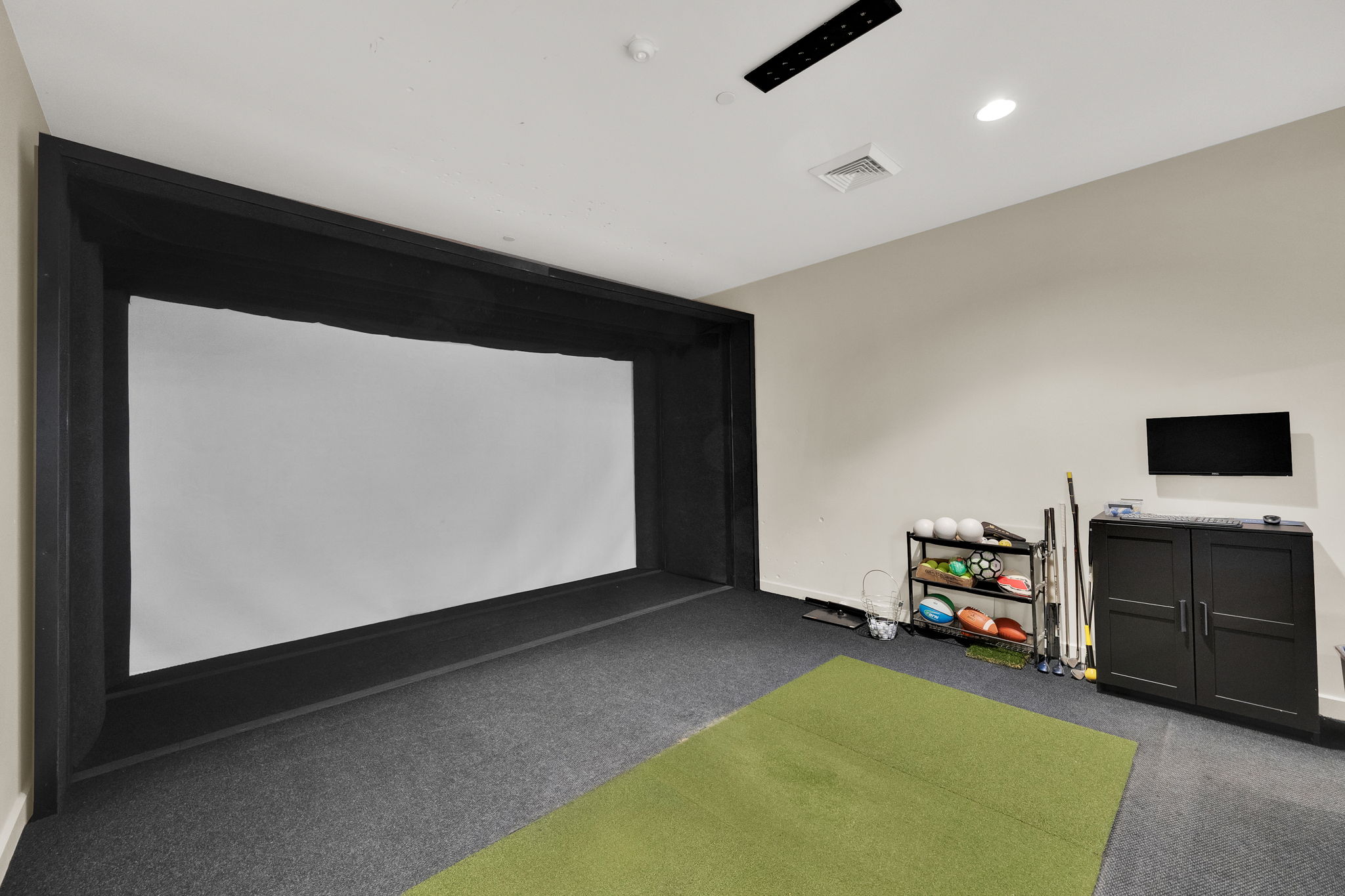 Recreation room with golf simulator, carpet floors, and recessed lighting