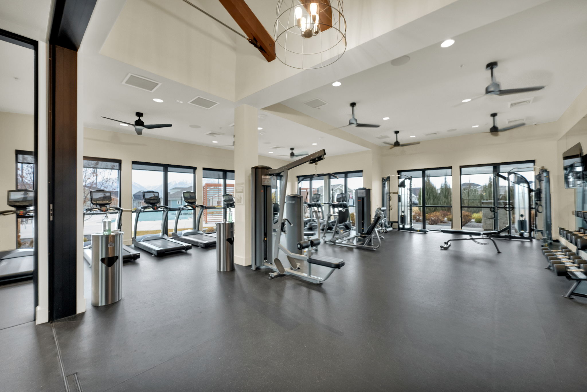 Workout area with recessed lighting and a chandelier