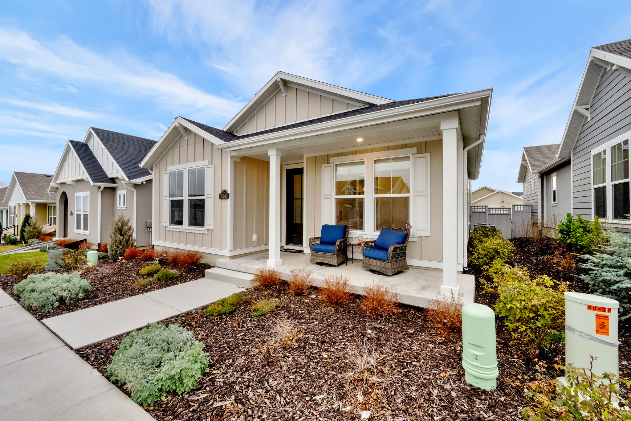 View of front of property with board and batten siding and a porch