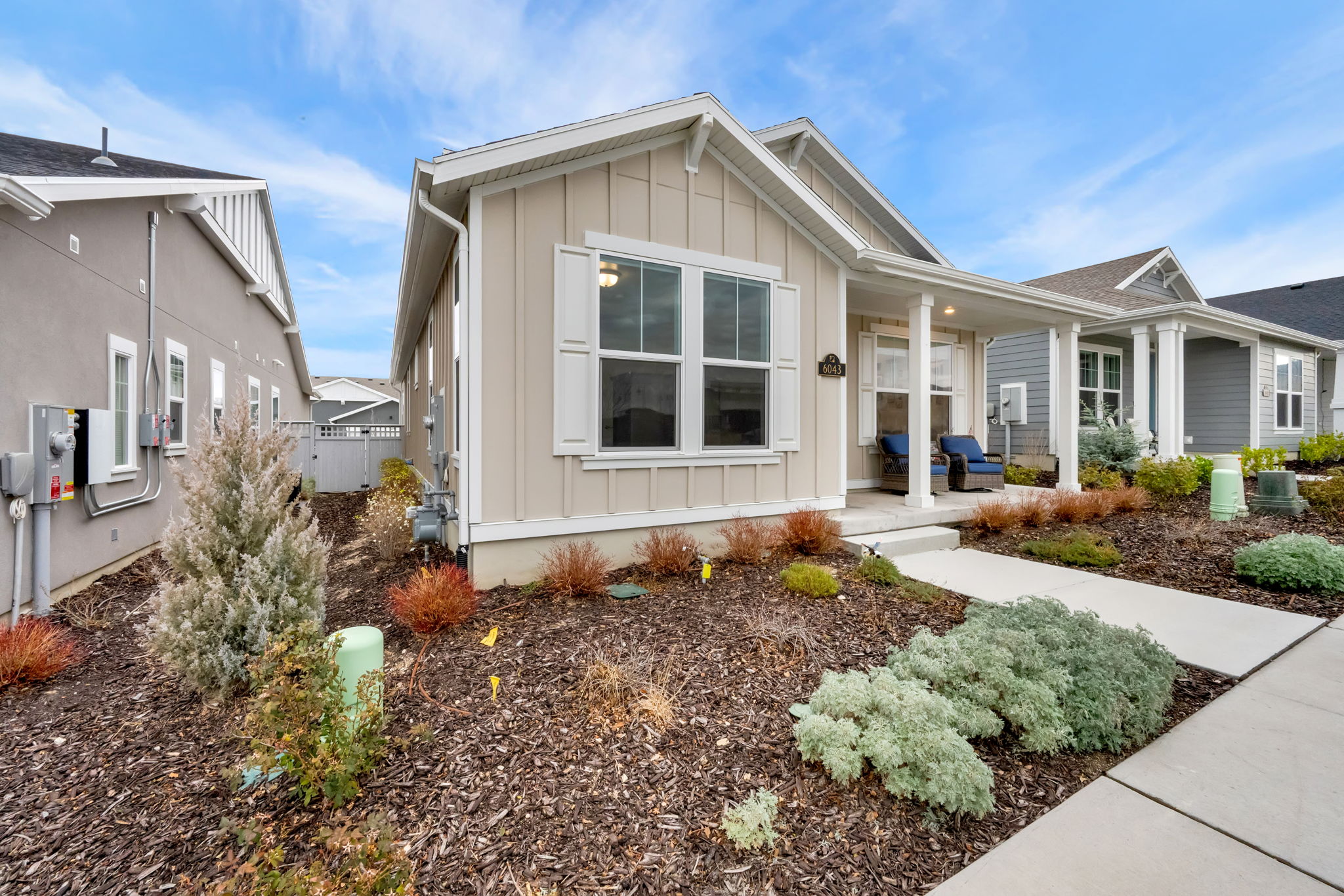 View of front of house featuring board and batten siding and covered porch