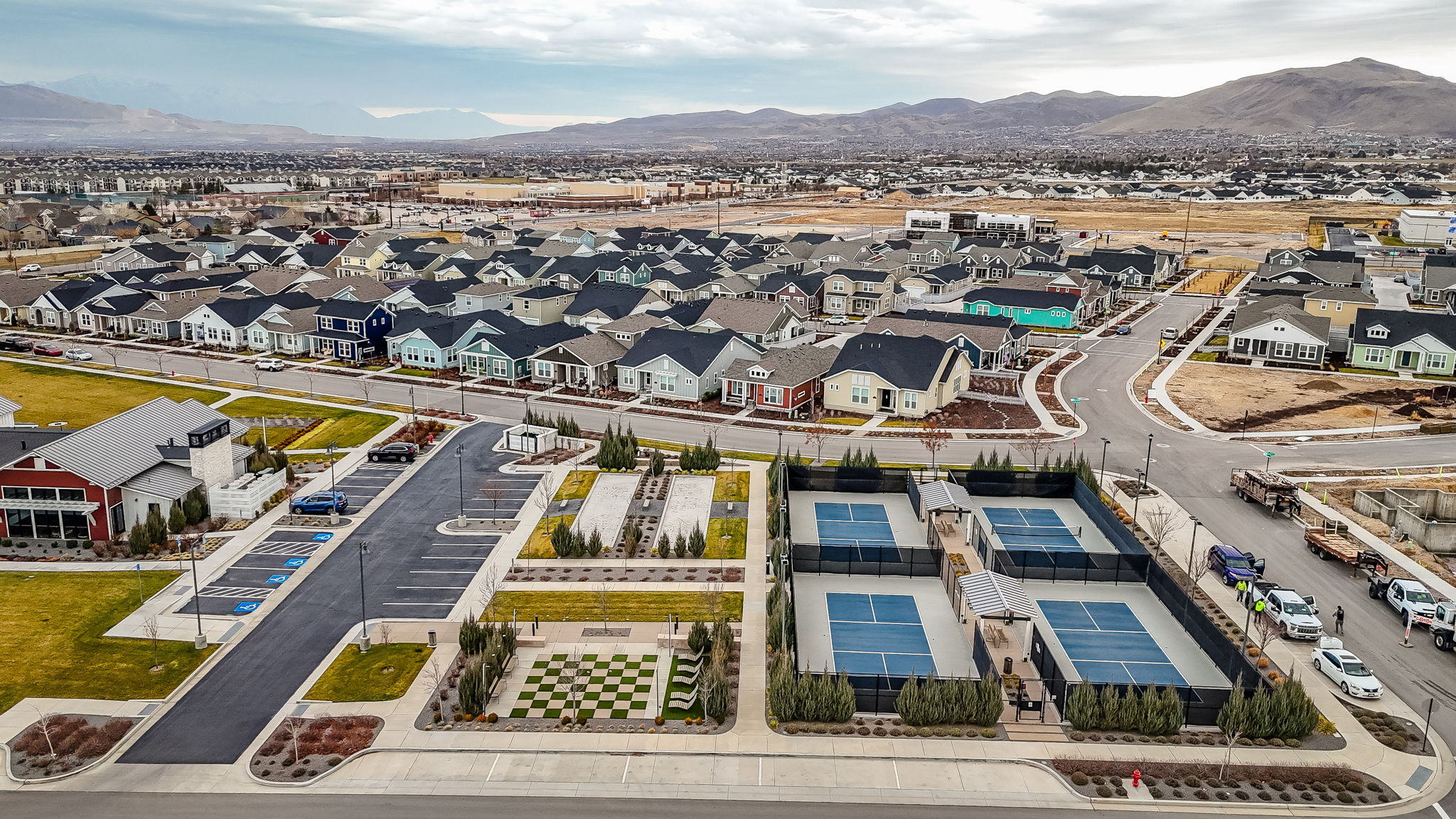 Aerial view of residential area featuring a mountainous background