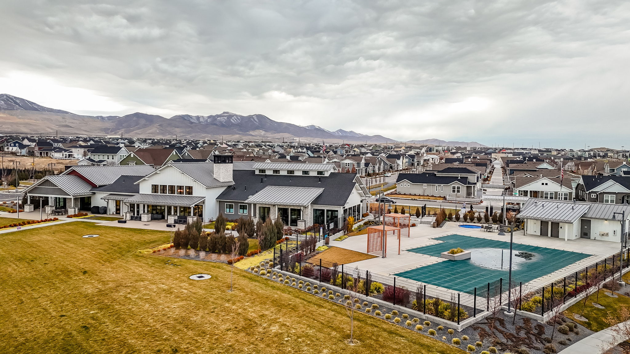 Aerial perspective of suburban area with a mountain backdrop