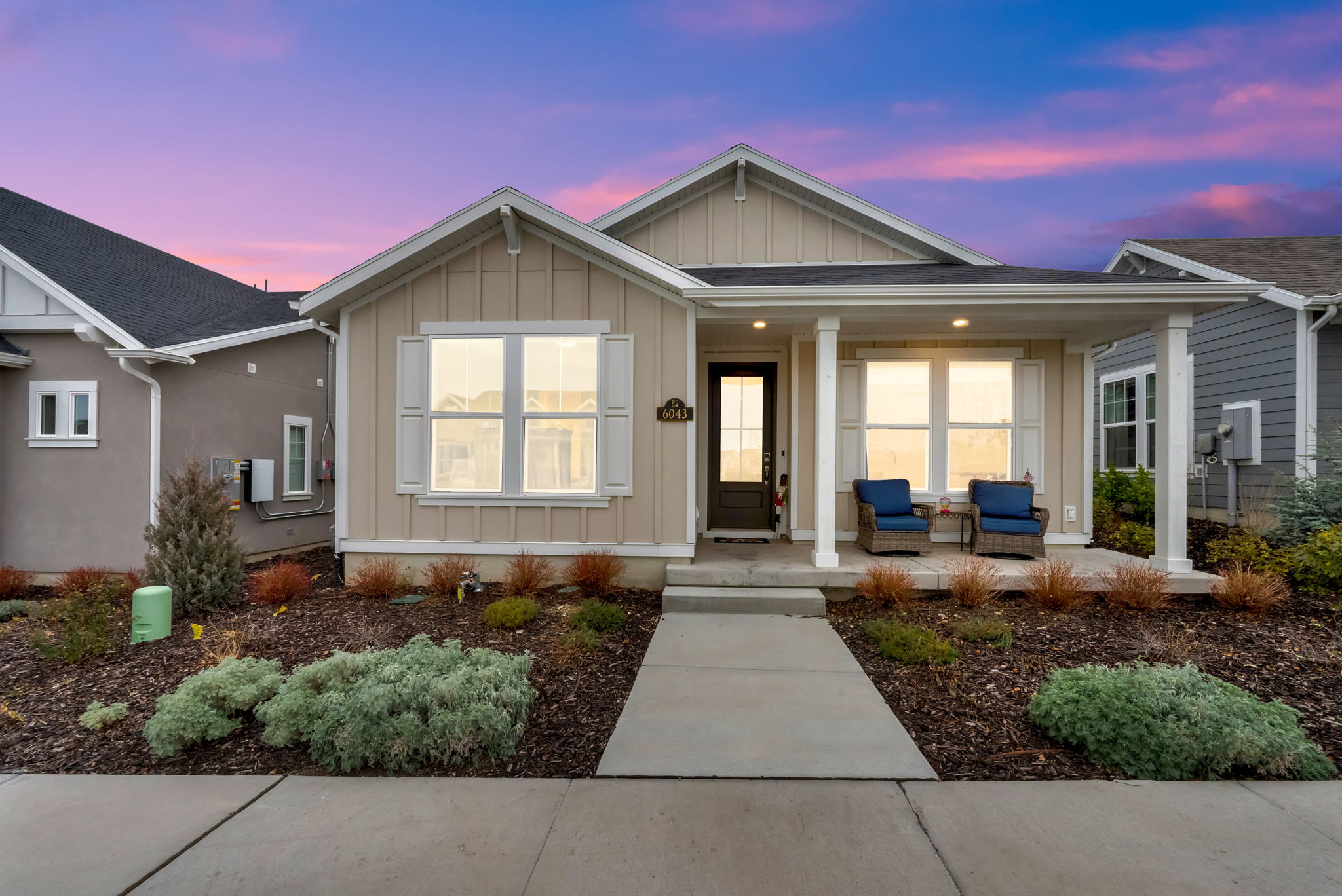 View of front of property featuring board and batten siding and covered porch