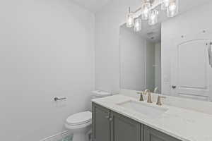 Bathroom featuring vanity and toilet