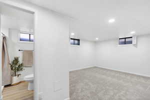 Basement featuring recessed lighting and baseboards
