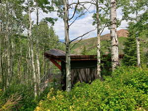 View of outdoor structure featuring a view of trees