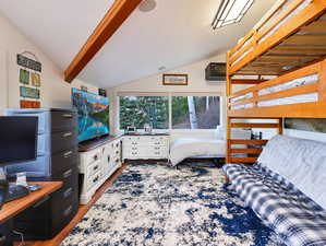Bedroom with light wood-style flooring and a desk
