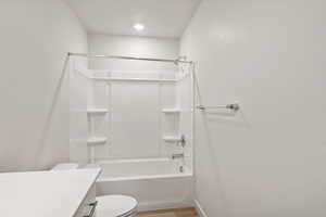 Full bath with bathing tub / shower combination and vanity