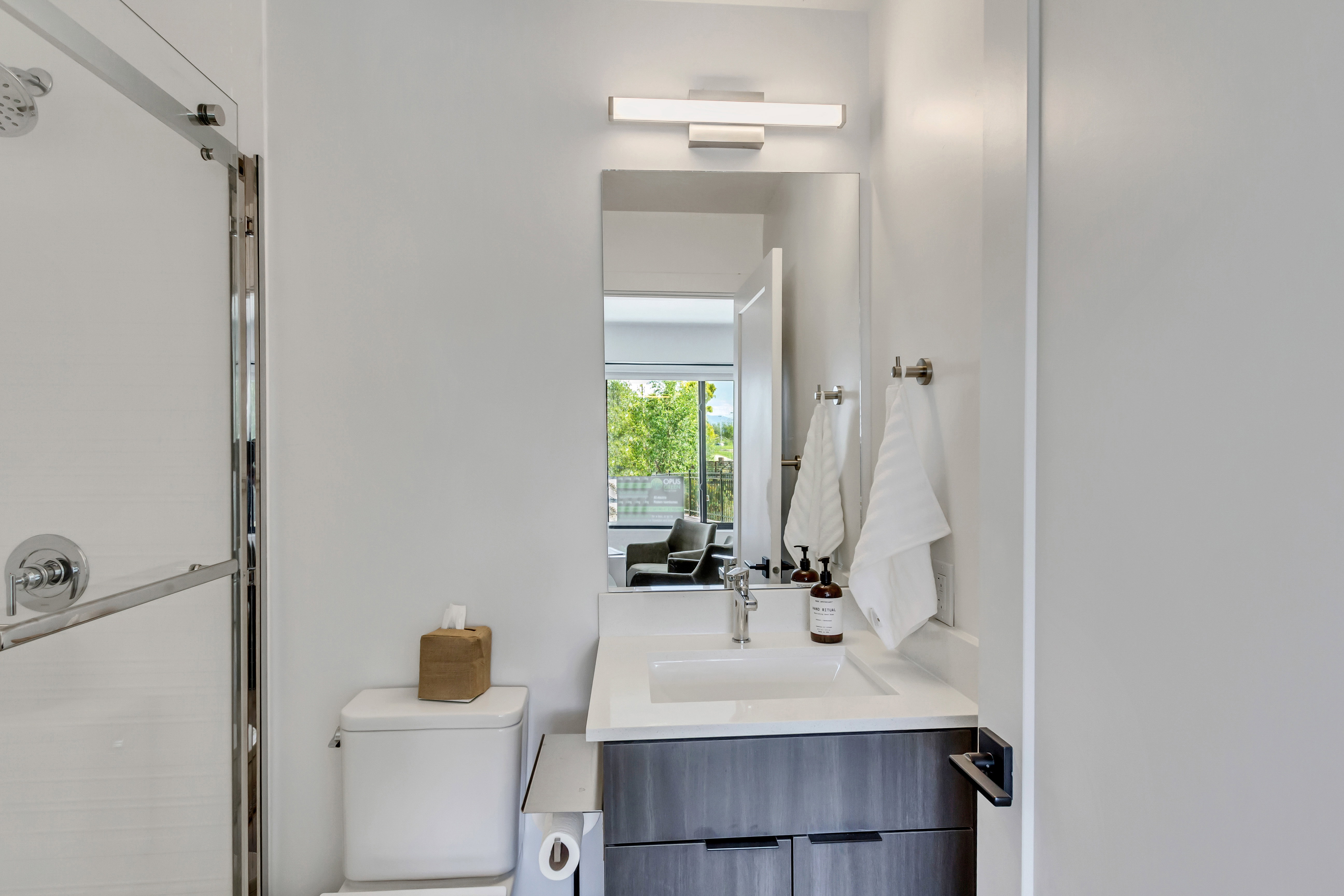 Bathroom featuring vanity and a stall shower