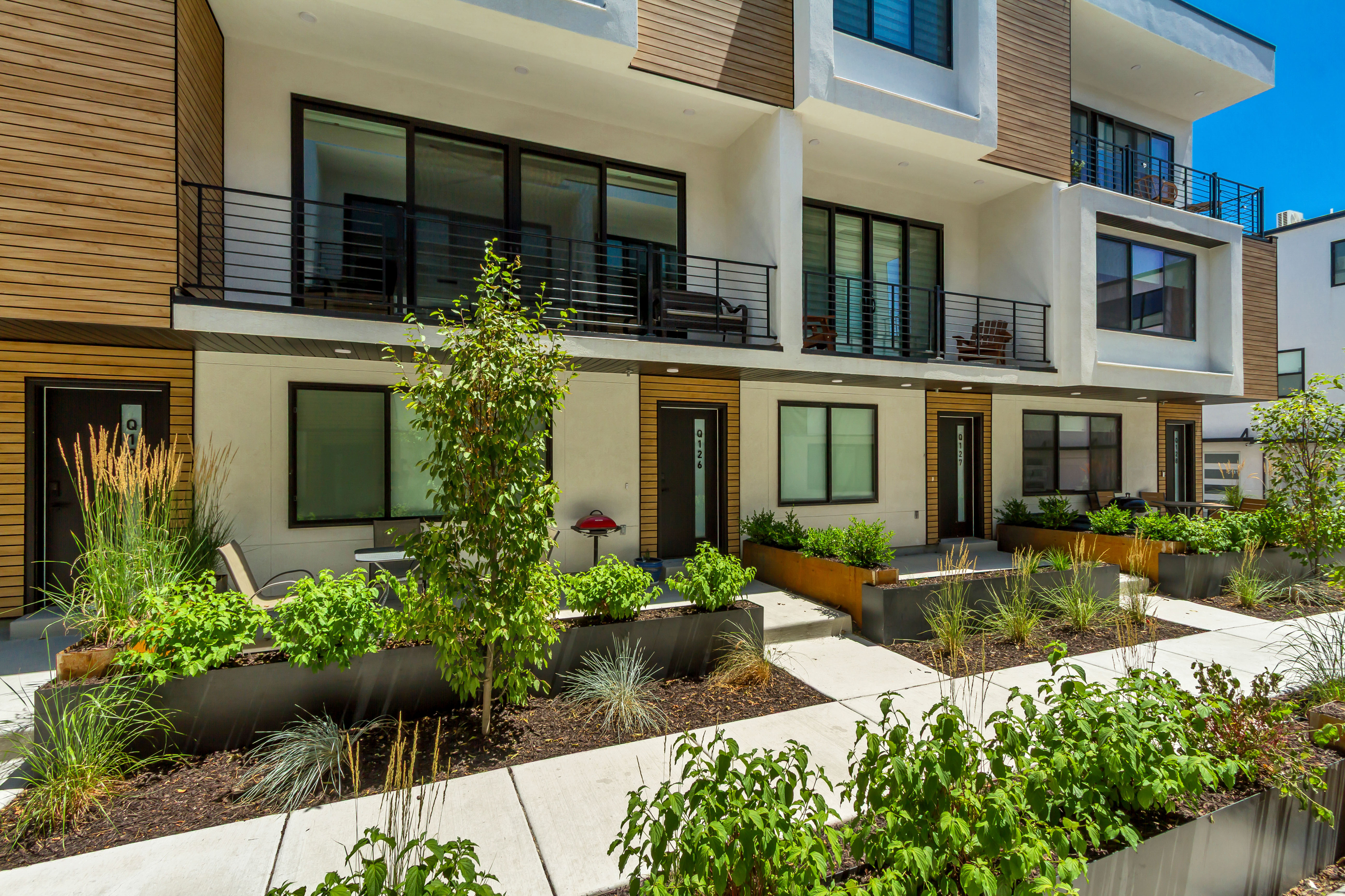 Back of property with stucco siding and a balcony