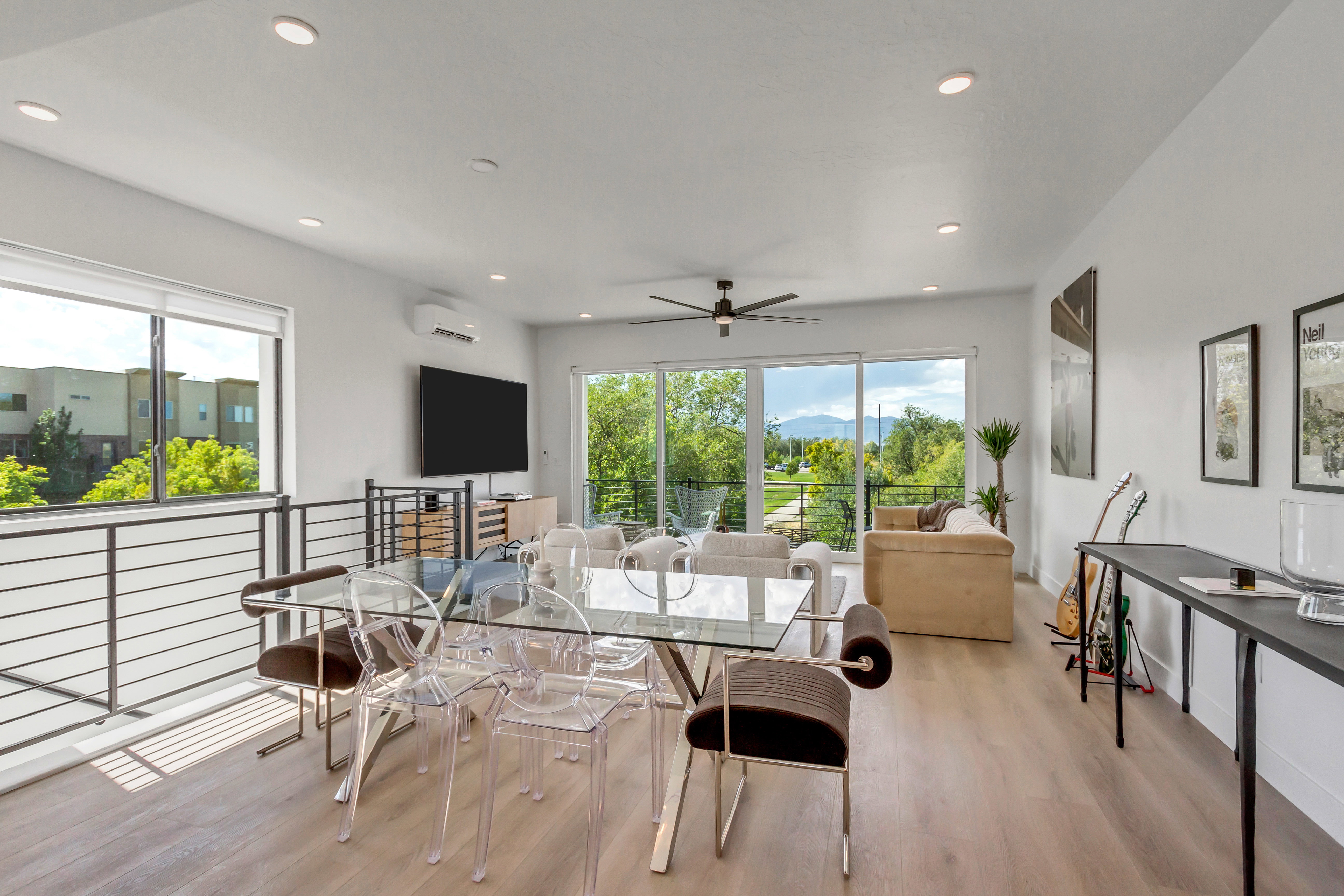 Dining room featuring light wood-style floors, a ceiling fan, and recessed lighting