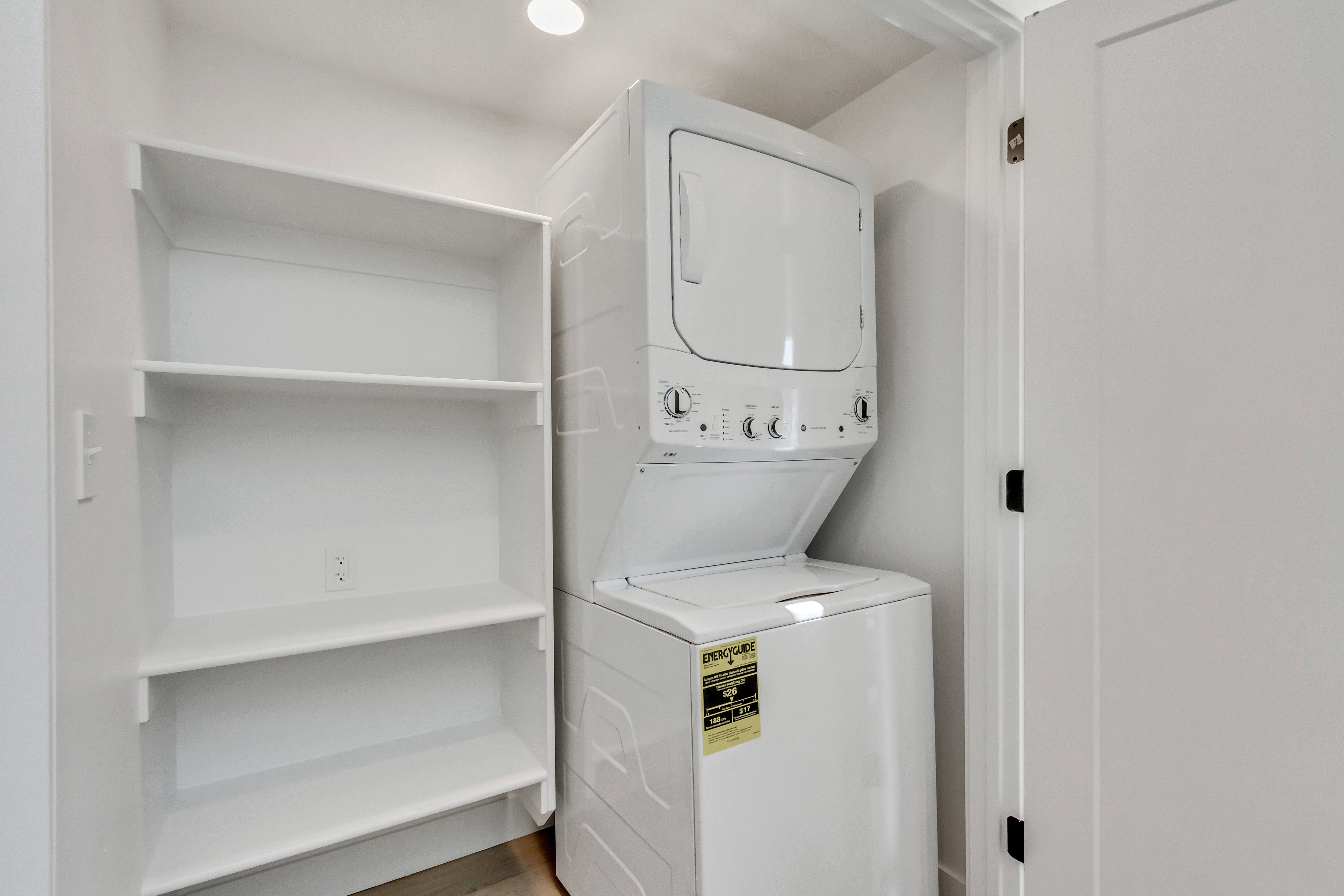 Laundry area with stacked washer / drying machine