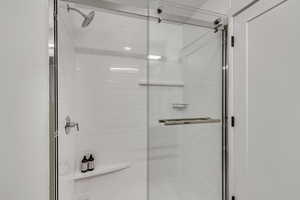 Full bathroom with a shower stall