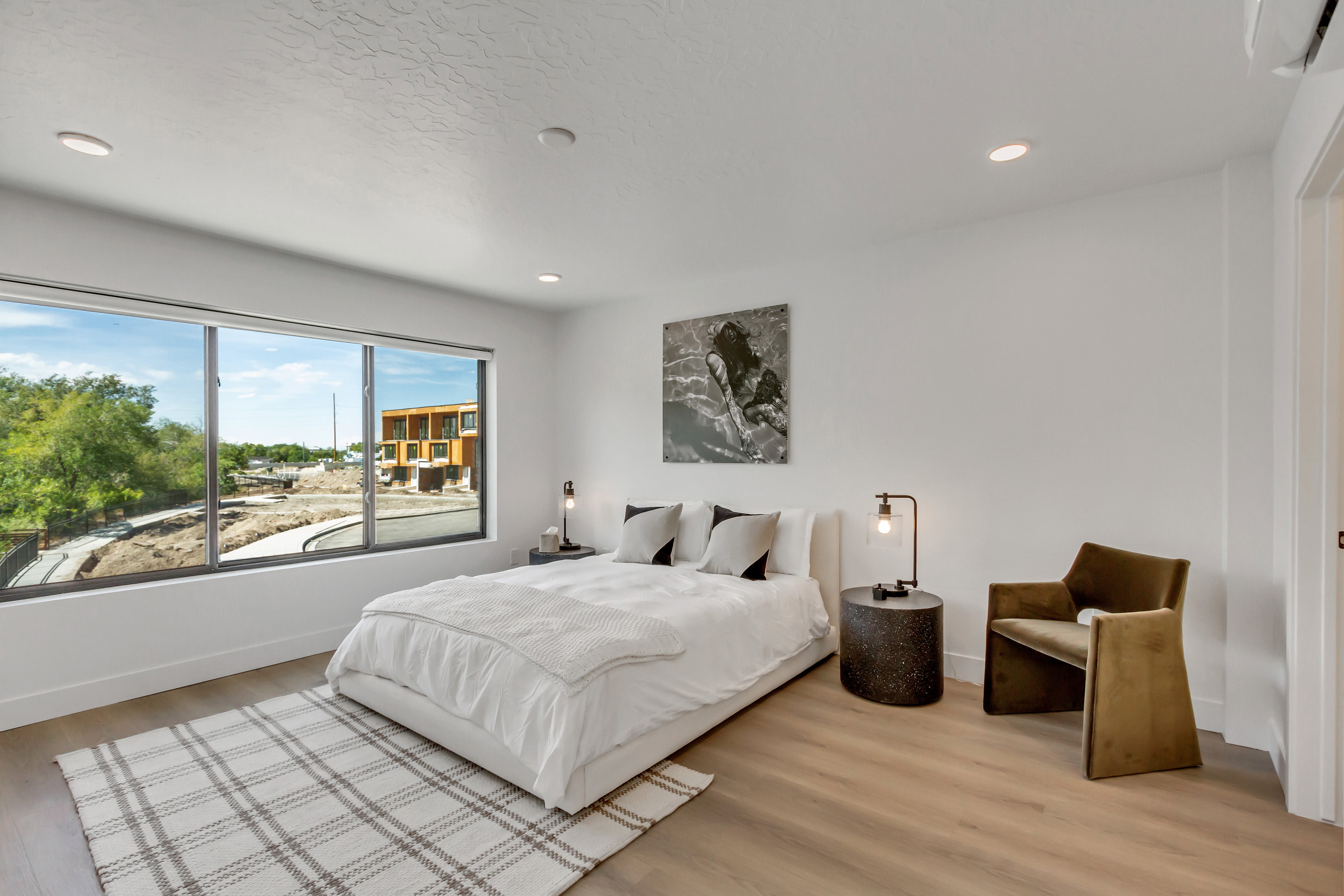 Bedroom with wood finished floors and recessed lighting