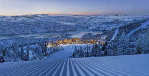 Snowy aerial view with a mountain view