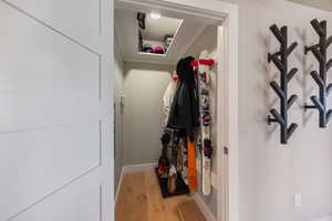 Spacious closet with light wood-style floors