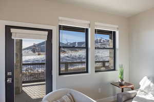 Bedroom with a mountain view and access to exterior