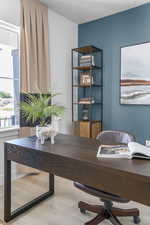 Dining area featuring a desk, wood finished floors, and a textured ceiling
