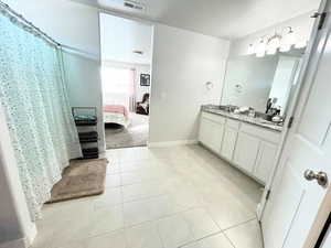 Full bath, double vanity, and very large storage space.