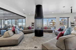 Carpeted living room featuring recessed lighting