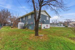 View of home's exterior featuring a central AC unit