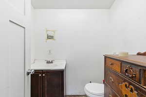 Bathroom with vanity and toilet