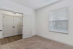Unfurnished bedroom with a closet and carpet floors