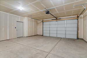 Garage featuring a garage door opener