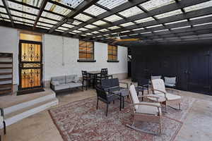 View of patio featuring an outdoor hangout area