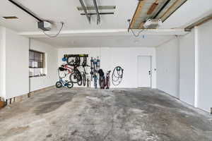 Garage with a garage door opener and car charger