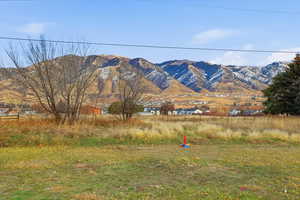 View of mountain backdrop featuring rural landscape