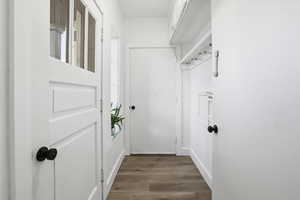 Doorway featuring wood finished floors