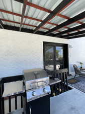 View of patio / terrace featuring grilling area and outdoor dining space