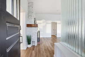 Corridor with light wood finished floors and baseboards