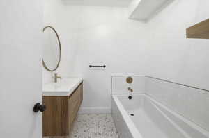 Bathroom with a bath and vanity