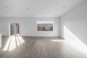 Unfurnished room featuring light wood-type flooring and baseboards