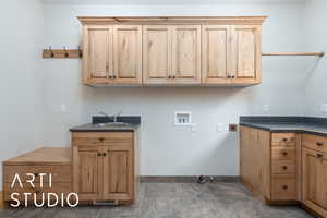 Laundry area with hookup for a washing machine, hookup for an electric dryer, and cabinet space