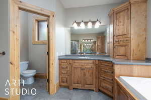 Full bathroom with vanity and a stall shower