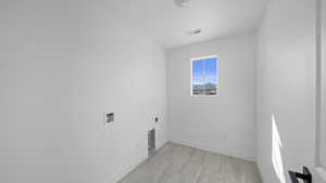 Laundry room with electric dryer hookup and washer hookup