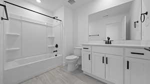 Bathroom with vanity and tub / shower combination