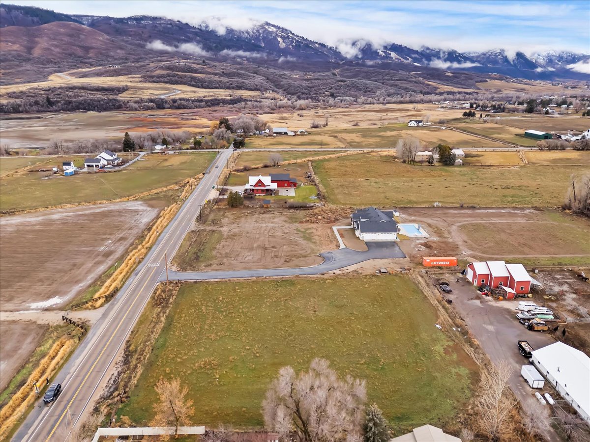 Aerial view of sparsely populated area with a mountainous background