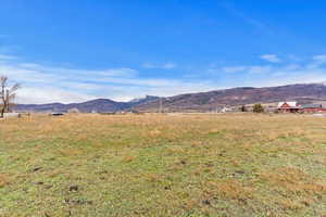 View of mountain backdrop with rural landscape