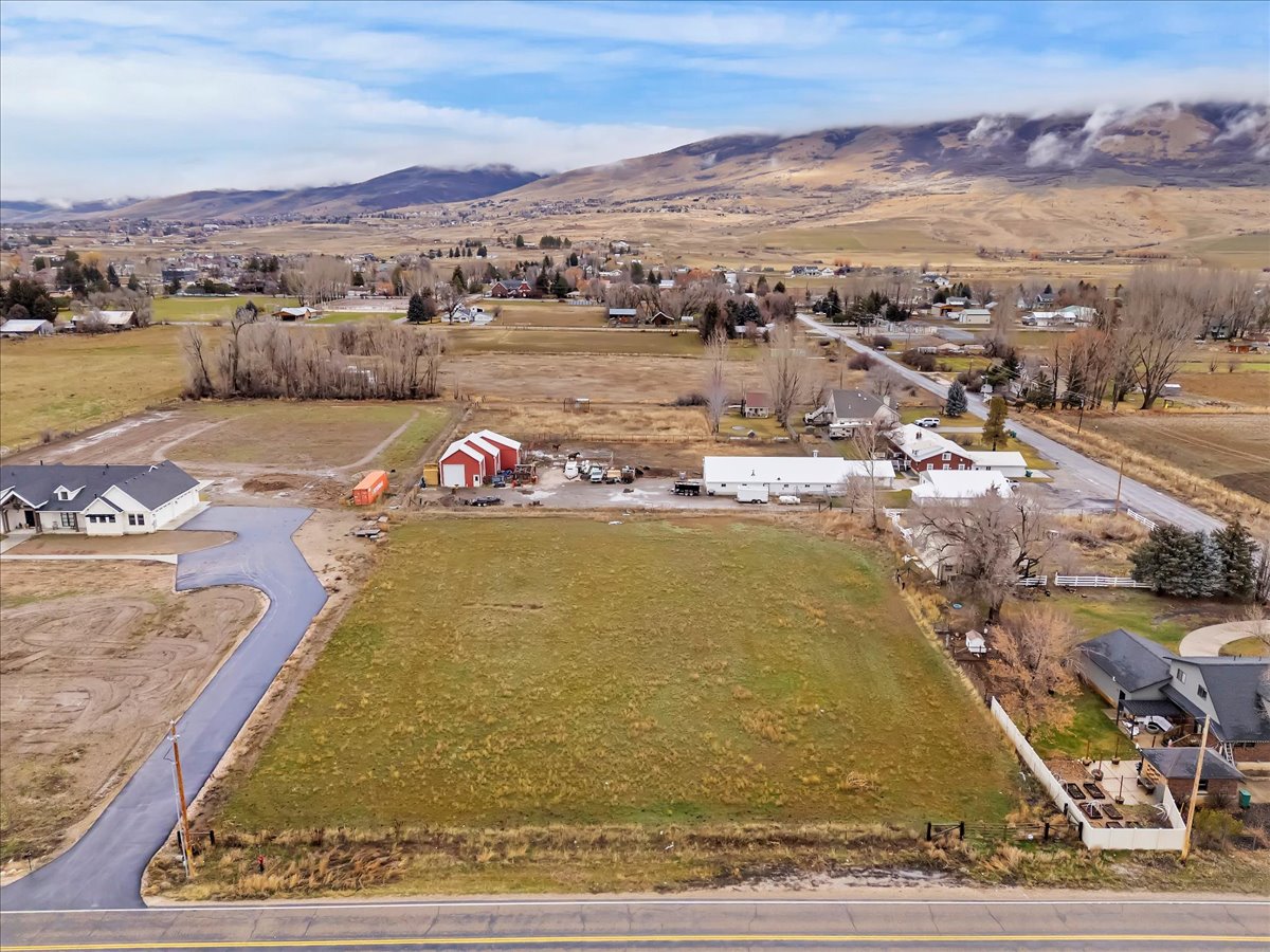 View of property location featuring a mountainous background and rural landscape