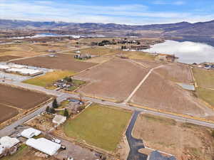 Aerial view of property's location with a water and mountain view